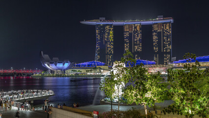 The Merlion fountain spouts water in front of the Marina Bay Sands hotel in Singapore timelapse...