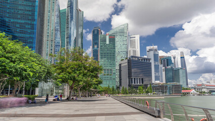 Fototapeta na wymiar Business Financial Downtown City and Skyscrapers Tower Building at Marina Bay timelapse hyperlapse, Singapore,