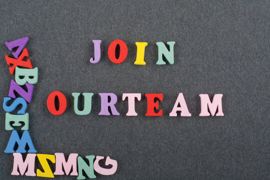 JOIN OUR TEAM word on black board background composed from colorful abc alphabet block wooden letters, copy space for ad text. Learning english concept.
