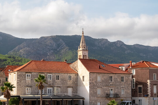 Close up view of catholic church St Mary in coastal town Jelsa on Hvar island in Dalmatia, South Croatia, Europe. Landmark in Mediterranean architecture of Balkan Peninsula. Travel destination summer