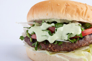 Burger with green sauce