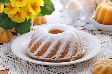 Bundt cake, babka with powdered sugar, close up view. Traditional Easter bundt cake