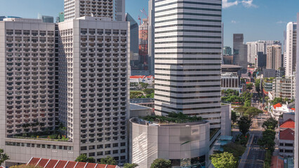 Obraz premium A beautiful morning panorama with Marina Bay area and skyscrapers city skyline aerial timelapse.