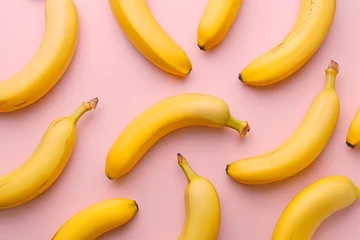 Fototapeten Pattern with bananas, top view, flat lay. Tropical abstract background. Banana on yellow background. Colorful fruit pattern, healthy eating, vegan, vitamins, super food concept, raw food © Magryt