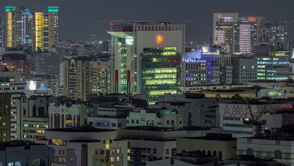 Aerial skyline of Abu Dhabi city centre from above night timelapse