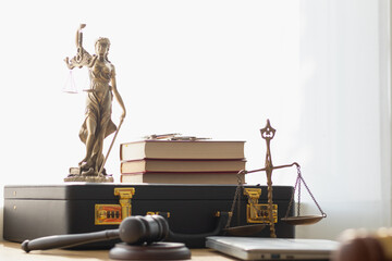 statue of god Themis Lady Justice is used as symbol of justice within law firm demonstrate...