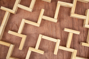 Top view of a wooden labyrinth, empty maze backdrop, soft focus