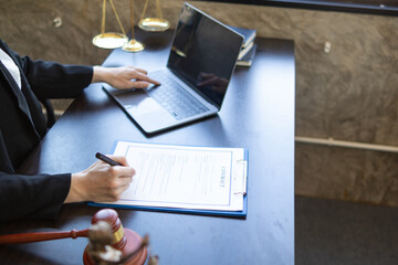 contract was placed on table inside legal counsel's office, ready for investors to sign the contract to hire a team of lawyers to provide legal advice for their investment. legal consulting concept - obrazy, fototapety, plakaty