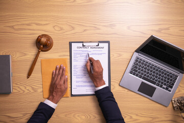 contract was placed on table inside legal counsel's office, ready for investors to sign the...