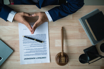 contract was placed on table inside legal counsel's office, ready for investors to sign the...