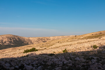 Panoramic view of dry stone walls mrgari on moon plateau seen from mountain top Hlam in Baska, Krk Island, Primorje-Gorski Kotar, Croatia, Europe. Hiking trail on barren deserted dry terrain. Ruins