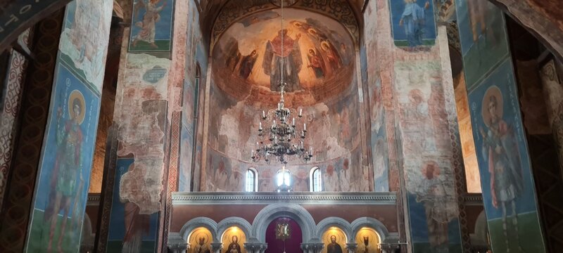 Ukrainian famous church of XII century. Cyril medieval church - today a museum. Scenic light in the dark. Heritage ancient and modern fresque on the walls.