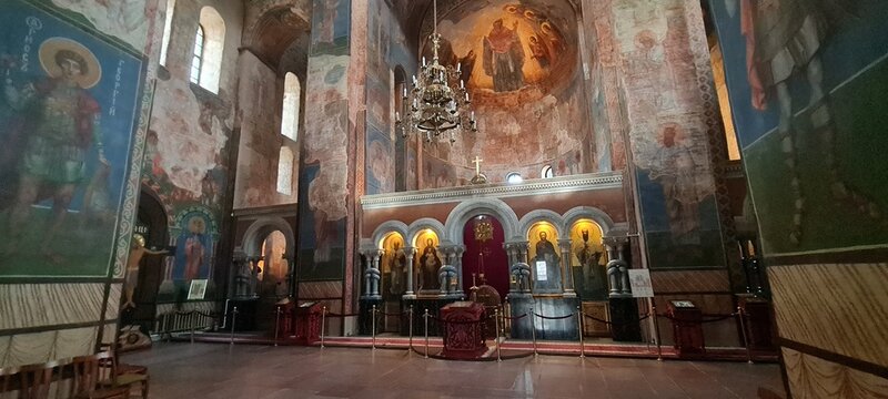 Ukrainian famous church of XII century. Cyril medieval church - today a museum. Scenic light in the dark. Heritage ancient and modern fresque on the walls.