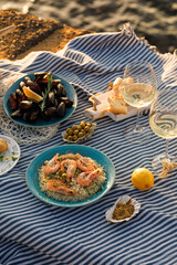 Shrimp, Seafoods, appetizers and salads on the table in Fish Restaurant. Beach Restaurant in Greece or Turkey. Aegean seaside, Greek or Turkish style fish restaurant in Bodrum, Santorini or Mykonos