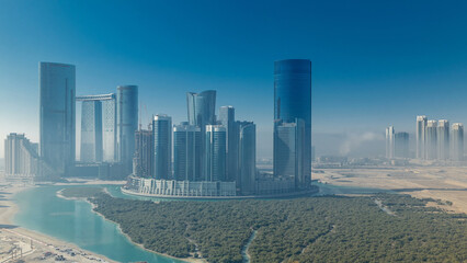 Buildings on Al Reem island in Abu Dhabi timelapse from above.