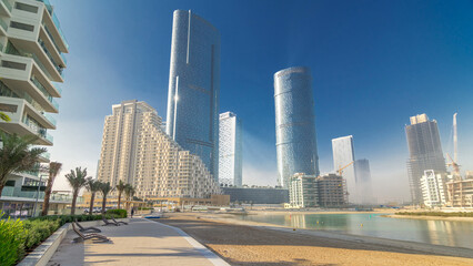 Fototapeta na wymiar Buildings on Al Reem island in Abu Dhabi timelapse hyperlapse