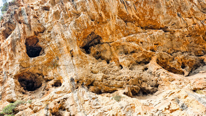 Caves on the orange cliffs of Sa Calobra, Mallorca