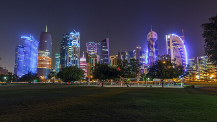 Fototapeta na wymiar The skyline of Doha by night with starry sky seen from Park timelapse hyperlapse, Qatar