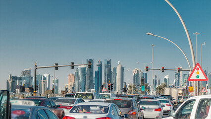 Doha skyline and traffic jam on the intersection timelapse in Doha, Qatar, Middle East.