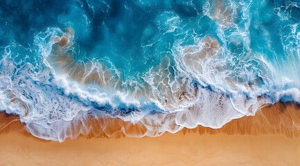 Aerial view capturing the stunning contrast of blue sea waves crashing onto a sandy beach, showcasing nature's beauty. - Powered by Adobe