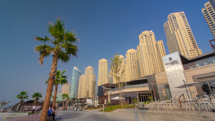 Fototapeta na wymiar People on the Jumeirah Beach in Dubai, UAE. Timelapse
