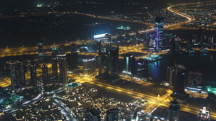 Fototapeta na wymiar Dubai downtown night with city lights from above timelapse