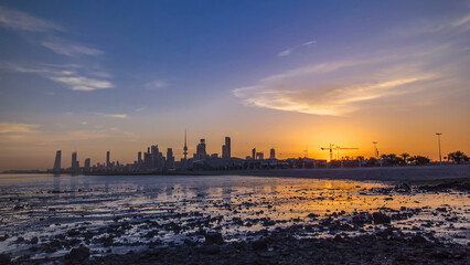 Seaside skyline of Kuwait city sunrise timelapse