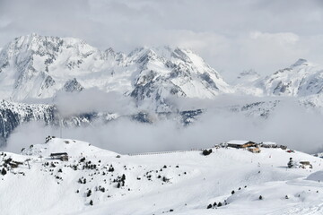 Fototapeta na wymiar snow covered mountains and slopes of Courchevel ski resort 