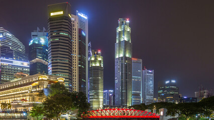 Singapore business district skyscrapers in the night time with water reflections timelapse hyperlapse