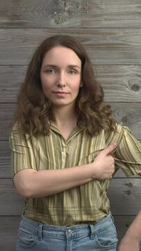 Person practicing EFT. Female tapping under arm (UA) meridian point. Vertical video.