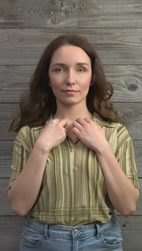 Person practicing EFT. Female tapping inner collarbone (CB) meridian point. Vertical video;