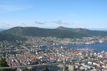 Aerial view of Bergen and harbor from Floyen viewpoint mountain in Norway. The electric cable...