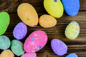 Easter eggs made of styrofoam on a wooden background. Top view