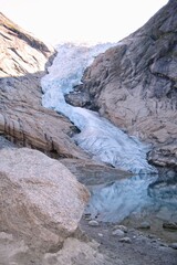 Briksdalsbreen glacier viewpoint in Jostedalsbreen National Park. Briksdalen icepeak with lake near Sogn og Fjordane. Briksdal with river in Olden, Norway