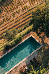 Idyllic Countryside Retreat with Serene Poolside View at Sunset