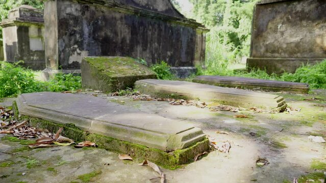 A movement shot of the unknown tombstone grave cemetery or graveyard in Kolkata, West Bengal, India