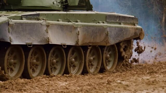 Russian T72 tank drives along a dirt road. War in Ukraine