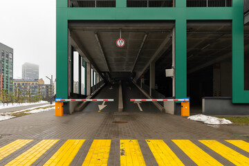 Entrance of the multi-level parking. Entrance to parking in a modern residential building. The...