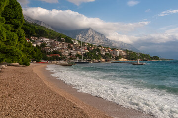 Idyllic beach Plaza Soline in coastal resort town Brela, the pearl of Makarska Riviera in Dalmatia,...
