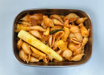 Pasta with baby corn in a tiffin box