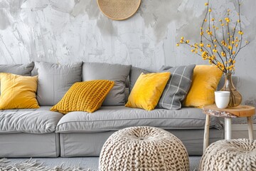 Fototapeta na wymiar A living room featuring a modern gray couch adorned with vibrant yellow pillows, creating a stylish and inviting atmosphere.