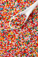 Colorful confectionery sprinkles. Decoration for cake and bakery. Top view