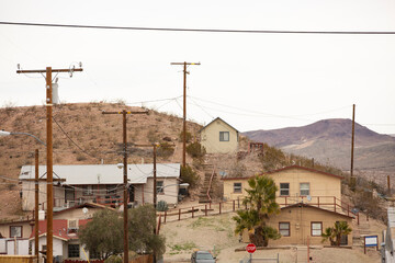 Fototapeta na wymiar Power lines frame a neighborhood in Barstow, California, USA.