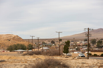 Power lines frame a neighborhood in Barstow, California, USA.