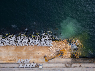 Rows of Concrete Blocks Along Beach