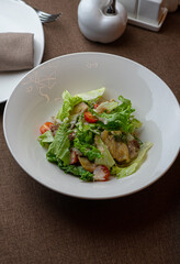 Caesar salad with a signature dressing at an exquisite restaurant.