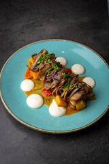Indulge in a diverse menu with beef tongue, ravioli, dumplings, and salads at our cozy cafe. Pair your meal with tea, wine, cocktails, and delightful desserts.



