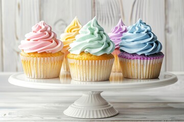 Tasty cupcakes with butter cream on cupcake stand - obrazy, fototapety, plakaty