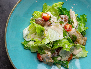Caesar salad with chicken and special sauce
