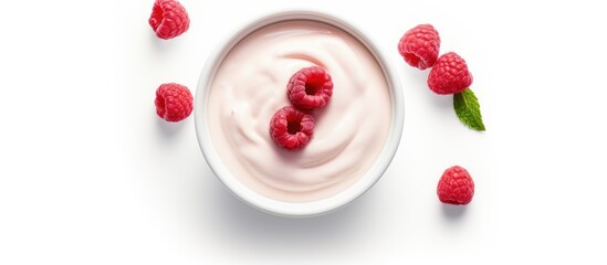 A serving of creamy yogurt topped with fresh raspberries, presented in a white dishware on a white background. A delicious and nutritious plantbased snack or dessert recipe